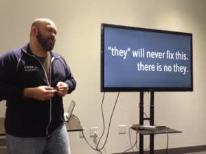 Carlos Moreno presents a slide saying, "They will never fix it. There is no they."