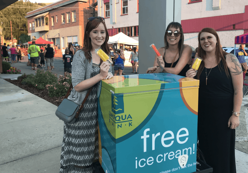 Photo by Becky McCray Haley, Jamie and Karlie hand out ice cream from their mobile ice cream cooler